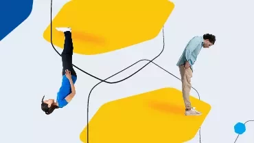 Two people on abstract yellow shapes, one upside down.