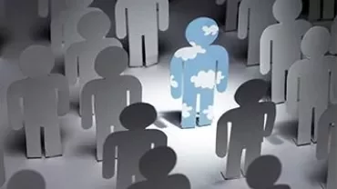 Paper cutouts with one cloud-patterned figure standing out.