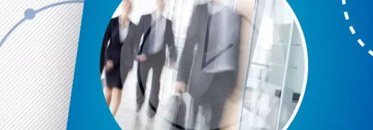Blurred motion of business people walking in an office corridor.